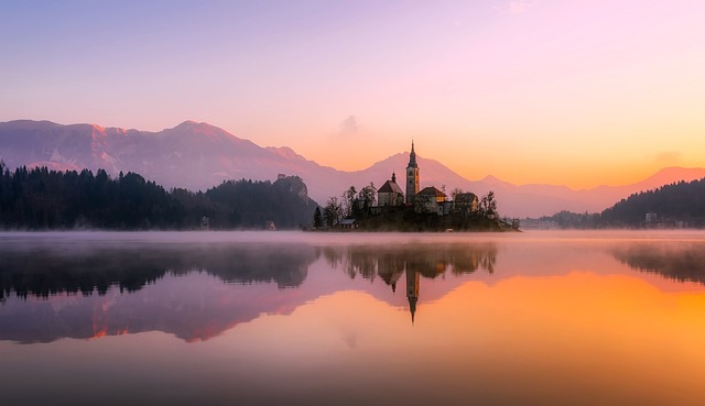 https://pixabay.com/photos/church-lake-sunset-panorama-bled-1993645/