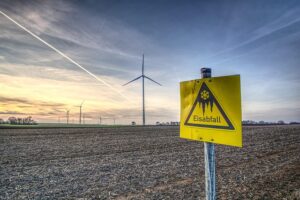 https://pixabay.com/photos/windmill-wind-energy-warning-sign-3979966/